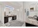 Expansive bathroom with dual vanities, a glass-enclosed shower, and stylish lighting at 24515 Bocage Way, Leesburg, FL 34748