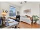 Bedroom featuring a desk, day bed, and a bright window at 24515 Bocage Way, Leesburg, FL 34748