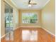 Bright bonus room with hardwood floors and sliding glass doors at 24515 Bocage Way, Leesburg, FL 34748