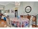 Dining room featuring a round table, hardwood floors, and classic decor at 24515 Bocage Way, Leesburg, FL 34748