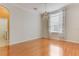 Dining room featuring hardwood floors and modern light fixture at 24515 Bocage Way, Leesburg, FL 34748