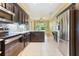 Modern kitchen features stainless steel appliances and granite countertops at 24515 Bocage Way, Leesburg, FL 34748