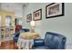 Cozy seating area with comfortable armchairs and access to the dining area at 24515 Bocage Way, Leesburg, FL 34748