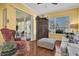 Bright living room featuring a large window, wood floors, and comfortable seating at 24515 Bocage Way, Leesburg, FL 34748