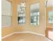 Sunny sitting area features large windows and tile flooring at 24515 Bocage Way, Leesburg, FL 34748