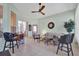 Relaxing sunroom with tile flooring, comfortable seating, and a ceiling fan at 24515 Bocage Way, Leesburg, FL 34748