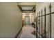 Inviting entryway with a unique ceiling design, a green front door, and an iron gate at 2696 Orange Peel Ct, Orlando, FL 32806
