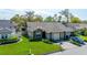 Well-kept single-Gathering home with a two-car garage and green lawn at 2696 Orange Peel Ct, Orlando, FL 32806