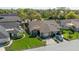 A well-maintained home with green lawn and driveway; features a composition roof at 2696 Orange Peel Ct, Orlando, FL 32806