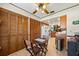 Bright eat-in kitchen features a wooden table set and abundant natural light at 2696 Orange Peel Ct, Orlando, FL 32806