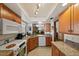Classic kitchen with wooden cabinets, modern appliances, and ample counter space at 2696 Orange Peel Ct, Orlando, FL 32806