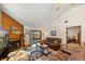 Comfortable living room featuring a fireplace, hardwood floors, and comfortable leather seating at 2696 Orange Peel Ct, Orlando, FL 32806