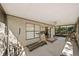 Enclosed patio with exercise equipment, a ceiling fan, and a door to the outdoors at 2696 Orange Peel Ct, Orlando, FL 32806