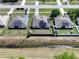 Aerial of homes with solar panels and a view of a serene body of water at 2720 Bancroft Blvd, Orlando, FL 32833
