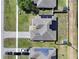 Aerial view showcases the home's roof, solar panels, and surrounding greenery at 2720 Bancroft Blvd, Orlando, FL 32833