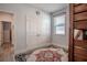 Cozy bedroom with a window view and warm colored rug in front of double doors to the bedroom at 2720 Bancroft Blvd, Orlando, FL 32833