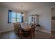 Inviting dining room with wood table, seating for eight, chandelier, and natural light from large window at 2720 Bancroft Blvd, Orlando, FL 32833