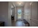 Bright entryway with coat rack and bench seating with view to exterior at 2720 Bancroft Blvd, Orlando, FL 32833