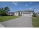 Charming single-story home featuring a well-manicured lawn, neutral paint, and a two-car garage at 2720 Bancroft Blvd, Orlando, FL 32833