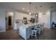 Bright kitchen features a large island with bar seating, stainless steel appliances, and hard surface countertops at 2720 Bancroft Blvd, Orlando, FL 32833