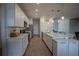 Bright kitchen features stainless steel appliances, hard surface countertops, and wood-look flooring at 2720 Bancroft Blvd, Orlando, FL 32833