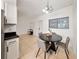 Dining area next to kitchen, featuring a round table with seating for four at 305 Hope Cir, Orlando, FL 32811