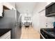 Cozy kitchen with stainless steel refrigerator and eating area, perfect for casual dining at 305 Hope Cir, Orlando, FL 32811