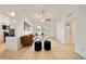 Open living room with tile flooring, comfortable seating, and easy access to the kitchen at 305 Hope Cir, Orlando, FL 32811