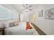 Comfortable main bedroom with a ceiling fan, soft textures, a modern art piece, and a relaxing ambiance at 305 Hope Cir, Orlando, FL 32811