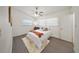 A well-lit bedroom with a ceiling fan, soft bedding, and a cozy rug creates a relaxing space at 305 Hope Cir, Orlando, FL 32811
