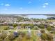 Aerial view showcasing the neighborhood's community and the lake at 30912 Fairvista Dr, Tavares, FL 32778