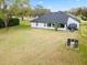 Aerial view showcases the home's backyard, trees and private setting at 30912 Fairvista Dr, Tavares, FL 32778