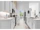 Spacious modern kitchen with stainless steel appliances, white cabinets, and bright natural lighting at 30912 Fairvista Dr, Tavares, FL 32778