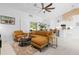 Bright, open living room featuring a cozy sectional sofa and neutral accents and decor throughout the living space at 30912 Fairvista Dr, Tavares, FL 32778
