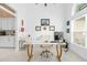 Bright home office with white furniture, natural light, and a dedicated workspace at 30912 Fairvista Dr, Tavares, FL 32778