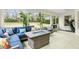 Inviting sunroom showcasing comfortable seating, a fire pit, and views of the outdoors at 30912 Fairvista Dr, Tavares, FL 32778