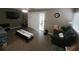 Comfortable living room with neutral walls, sliding glass doors, and plenty of natural light at 3243 Little Sound Dr, Orlando, FL 32827