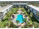Aerial view of resort buildings showcasing the common areas, pool, and meticulously landscaped grounds at 325 N Causeway # 2080, New Smyrna Beach, FL 32169