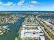 Wide aerial view of the resort community, showing the waterfront, pool, and residences at 325 N Causeway # 2080, New Smyrna Beach, FL 32169