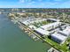 Extensive waterfront condo resort with boat docks, community pool, and manicured grounds, as seen from above at 325 N Causeway # 2080, New Smyrna Beach, FL 32169