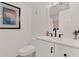Well-lit bathroom with white vanity and toilet at 325 N Causeway # 2080, New Smyrna Beach, FL 32169