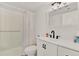 Clean, white bathroom featuring a modern vanity, dark fixtures, and combined shower and tub at 325 N Causeway # 2080, New Smyrna Beach, FL 32169