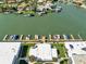 Aerial view shows boat docks for the condo community on the water at 325 N Causeway # 2080, New Smyrna Beach, FL 32169