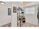 Bright hallway with tile flooring and unique decor including a decorative baker's rack for storage at 325 N Causeway # 2080, New Smyrna Beach, FL 32169