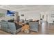 Large living room with lots of seating, a TV, and hardwood flooring at 325 N Causeway # 2080, New Smyrna Beach, FL 32169