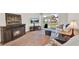 Open-concept living area with a fireplace and access to the balcony at 325 N Causeway # 2080, New Smyrna Beach, FL 32169