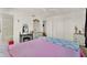 Spacious main bedroom features a soft color scheme, ceiling fan, and ample closet space at 325 N Causeway # 2080, New Smyrna Beach, FL 32169