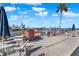 Waterfront patio with tables, chairs and umbrellas to enjoy the beautiful water views and breezes at 325 N Causeway # 2080, New Smyrna Beach, FL 32169