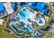 Aerial view of a sprawling resort pool area with lazy river and other amenities at 3320 Lilac Way, Davenport, FL 33897