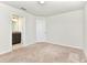 Carpeted bedroom with bathroom entrance at 3320 Lilac Way, Davenport, FL 33897